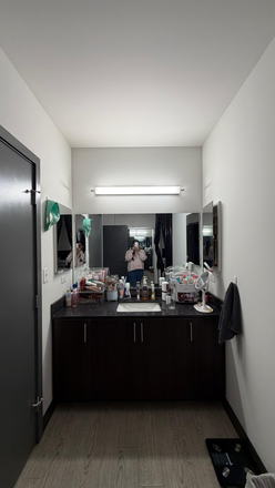 In room washbasin with plenty of storage under the basin and on the sides as well - Lightview Apartments