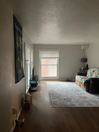 Living room, window looks out to street - Spring 2026 Sublease - In-Between The Hill and Pearl Apartments