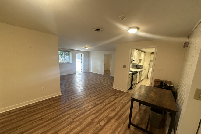 living space - LOCATION! 3 Bed/2 Bath w/ Heat, Hot Water Included, LAUNDRY IN UNIT, PARKING Inclu!! Avail. 8/1/24!! Apartments