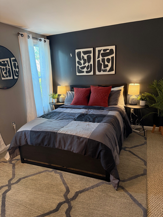 Bedroom with full size bed, nightstands and lamps - Furnished Private Room with Private Full Bath, All Utilities Included, Walk to UMB