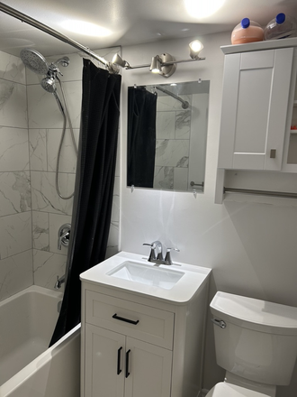 Freshly renovated bathroom - 1 furnished bedroom in a 2-bedroom St-Clair West condo