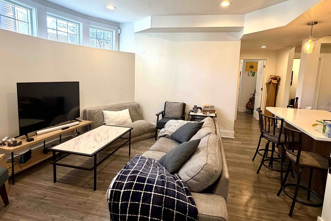 living - SPACIOUS BRIGHT 4 BED/2 BATH WITH IN-UNIT LAUNDRY AND WATER/SEWER INCLUDED! 9/1/26! Apartments