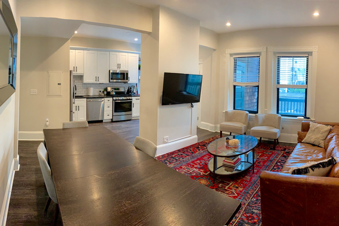 Open kitchen / living room - Amazing, renovated 4 bedroom right on Tremont Street in Mission Hill Apartments
