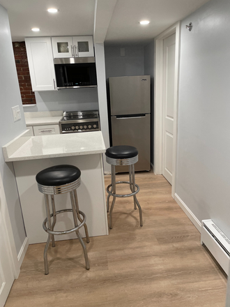 Kitchen island with granite - E Boston, Cozy 1 BR, $1,595/mo (INCLUDES ALL UTILITIES), 5 min walk to T, 2 stops to Suffolk Univ Apartments