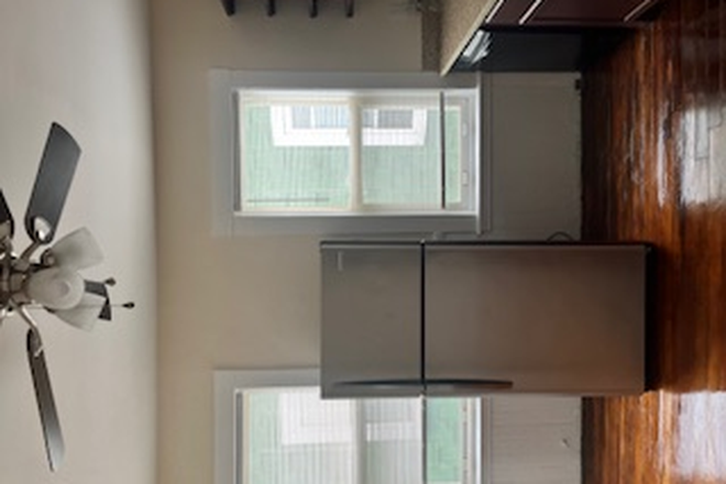Kitchen windows - Beautiful Top Floor, Sunny 3 Bedroom apartment shuttle bus to UMB