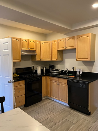 Kitchen - Gorgeous 3 bed 1 bath apartment with quartz countertops and laundry in building.