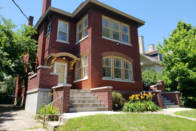 Front of house with concrete front patio - Large Duplex close to campus Rental