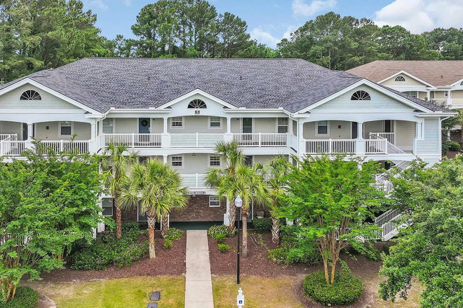 Building front - Private & peaceful 2 bed/2 bath condo in a gated community w/ pools & beach access (Barefoot Resort)