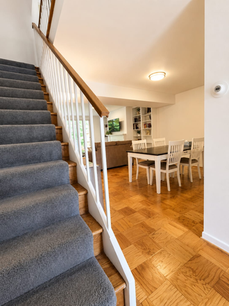 View of living area to upstairs with 2 ensuite bedrooms - 2BD/2.5BA Furnished Townhouse ideal for Visiting Professionals. Bi-weekly cleaning included