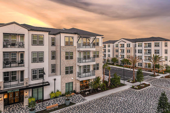 This is how the apartments look from the outside. They have elevators in every building and this is where the clubhouse is. - Aero on 24th Apartments