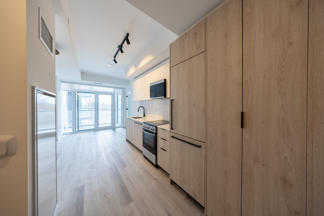 Kitchen and Balcony - Brand New Condo 1 Bedroom + Den with Two Bathrooms - ideal for Two Students or Staff near UTSC