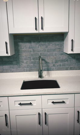 Brick backsplash - BRIDGEPORT- IN UNIT W/D Apartments