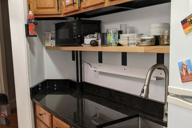 Part of kitchen counter - Clean + Stunning Apartment Right Off The Green Line (AMAZING LANDLORD)