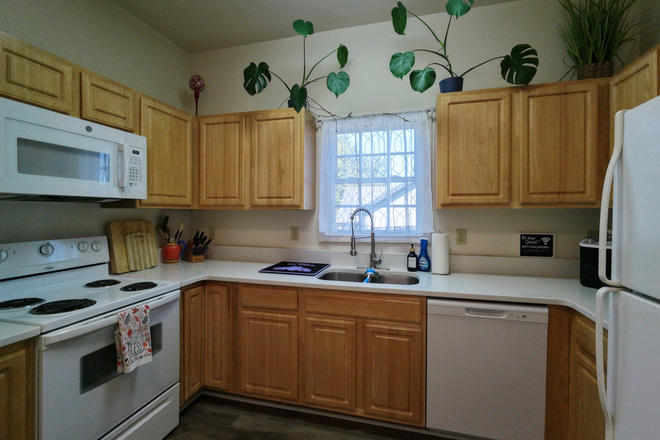 Durham Chills Fully Furnished Kitchen with Dishwasher, Microwave, Full sized stove, Fridge, and more - Furnished 3BR Home Near Duke | Office, Fiber Wi‑Fi & Fenced Yard
