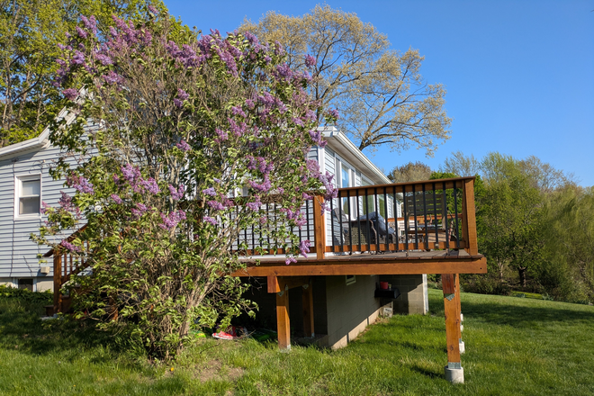 Side view of house - Family house on bike path with water view.   Rental by month.  No summers, no Christmas vacation.