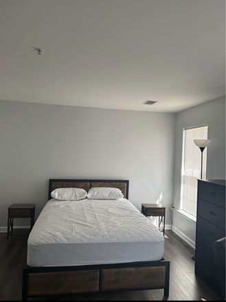 Bed, dresser and two night stands in bedroom - Room for Rent in Townhouse with private bathroom and parking