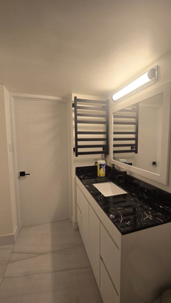 Modern bathroom vanity, heated towel rack - ​Bright Furnished 1BR+Den Walk-out Suite near UTM | Utilities Incl. House