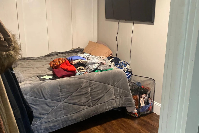 Bedroom is large there is a desk area and two windows on opposite side - Durfee Street Apartments