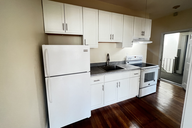 Visit hubrealtyproperties.com - Top floor 2 bedroom with brand new kitchen, new hardwood floors, on the green line T Apartments