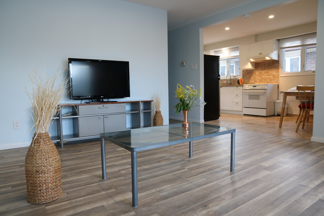Main Floor Living Room - 2 PRIVATE bedrooms main floor (1) + raised basement (1)/single occupancy/fully furnished