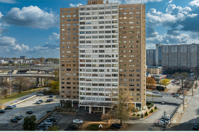 High-Rise Apartment Building Exterior - Landmark Condo Near Georgia State