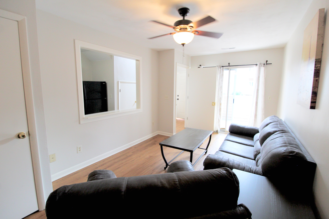 Living room - PENDING RENEWALS! Beautiful townhome for rent - furnished and utilities included! 1420 Bradley Drive