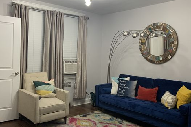 Living Room - All Utilities Included, 10Min walk from Red Line, 25% off 1 month rent w/ 12mo lease signing. Townhome