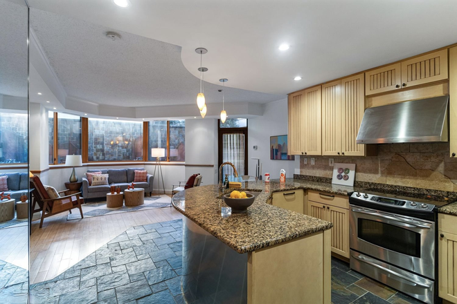 Living Room view from the front door - Garage Parking + W/D + Heated Kitchen Floors | Morning Sun | 1BD w/Private Patio Coming! Condo