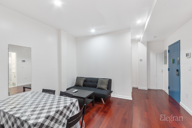 3BR Unit: Living Room - Modern, Elegant Studio, 2 BR, and 3 BR Apts in Downtown Manhattan; Walking Distance to Campus
