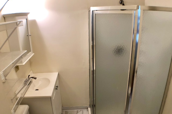 Tile bathroom - Available July 1 2026 Apartments