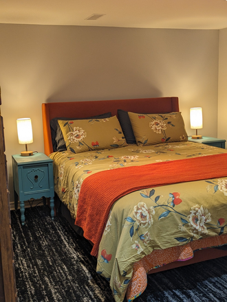 Bedroom with queen bed - Fully Furnished Studio Basement Apartment Close to Subway Short Term Rental
