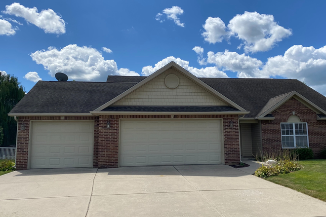 house - Spacious Primary Bedroom with Ensuite and Walk-In Closet, and one car garage space available