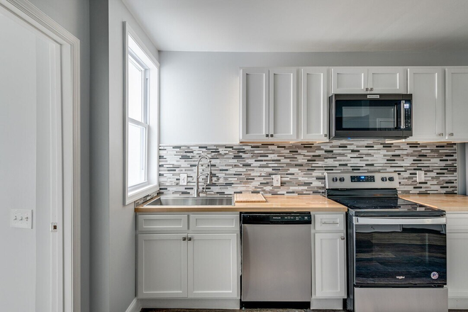 Kitchen - Upgraded and furnished 2 Bedroom Duplex