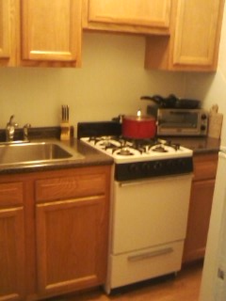 Hub Realty - Front facing studio with alcove, renovated kitchen, in Allston Apartments