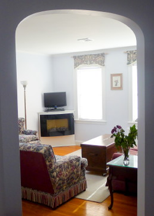 Arched entry into living room - Fully furnished, one BR at good location Apartments