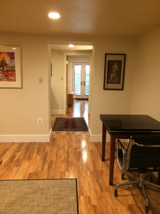 View from kitchen to exterior entrance - Woodside Retreat Apartments