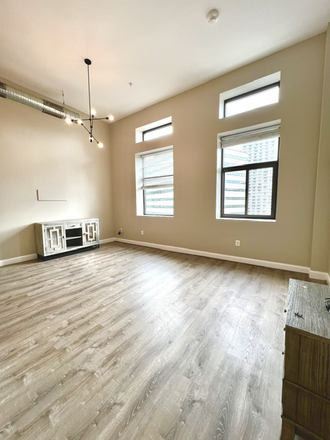 Living room space - 109 W Lexington Apartments, modern, downtown, great transportation options