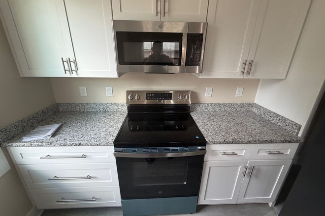 Brand new kitchen with granite tops and stainless appliances - BRAND NEW 4BR 2BA, 1 Block to Campus!