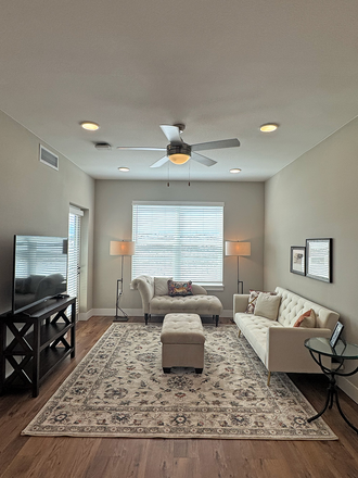 View of living room from kitchen. - Reduced Rent for Lease Takeover / Sublet in New Luxury 1 bed/ 1 ba Apt