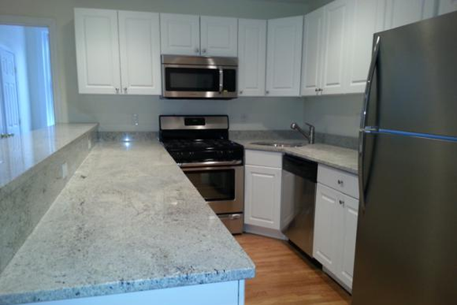 Visit hubrealtyproperties.com - Handy 3 bedroom with renovated kitchen, on Green line T Condo