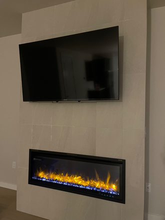 Mounted 4k TV with fireplace and remote control - 2025 BUILT NEW EAST MOUNTAIN HOME W/AMAZING VIEWS,  5 MINUTES FROM CAMPUS AND SHOPPING,  PETS ALL