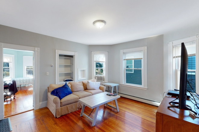 Living Room - Renovated 3 Bedroom in Porter Square Apartments