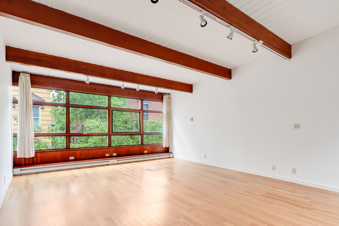 Main living area looking out on Joy Street - Light-filled and elegant Beacon Hill one-bedroom apartment available June 1