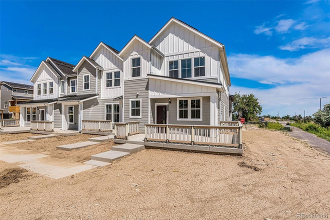 Exterior. This was taken a year ago, and we now have a shared grass space, plants, and some small trees. - Modern Town-home