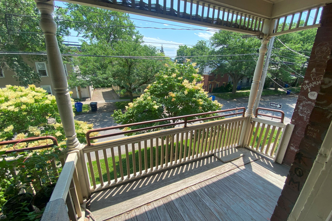 Front Balcony - Spacious 3 Bedroom with Balcony and Hardwood Floors Apartments