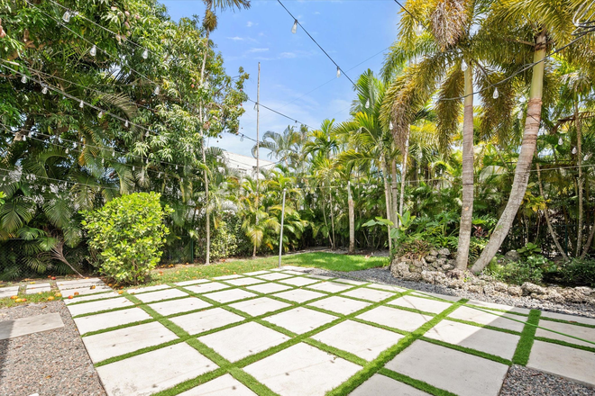 Backyard - A gorgeous Coral Gables home with Lucious landscape and a spacious backyard!