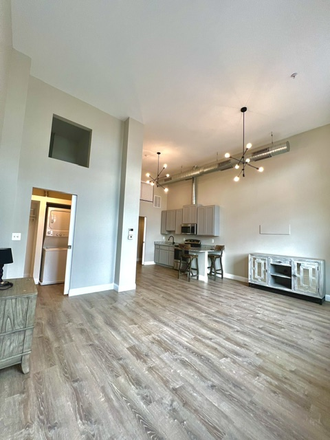 Living/kitchen space - 109 W Lexington Apartments, modern, downtown, great transportation options