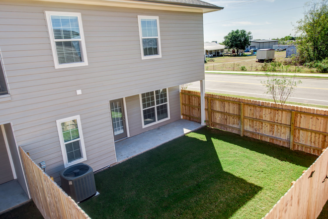 Backyard - 4 Bedroom/4.5 Bathroom townhome with garage and yard! Available in August