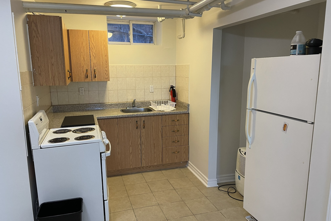 Kitchen - Bachelor  basement apt. All utilities included + Landry  kitch Bath Sep.entrance. 5 min.  DuPont TTC