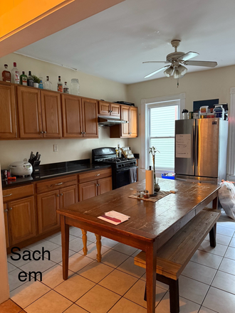 Left side of kitchen with silver refrigerator - NO FEES, LARGE 6 beds, less than a mile to school Apartments